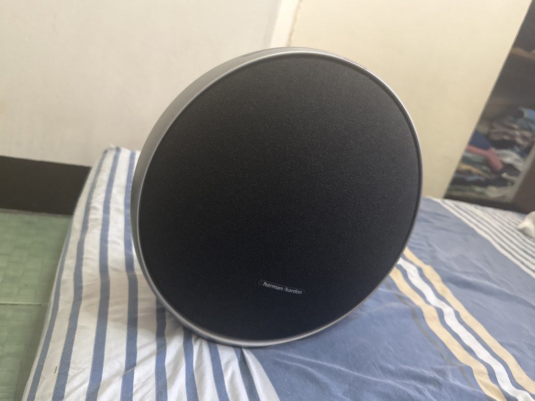 Harman Kardon Onyx Studio 9 Wireless Speaker (Category: Soundbars, Speakers & Amplifiers) located in Manila. Submitted by warm.ronmiles (Listing ID 1467670145, Image 1). Description: - Authentic Harman Kardon speaker in stylish black with a modern silver trim - Iconic round silhouette with a clean, undamaged fabric grille and stable circular base - Versatile connectivity: Bluetooth, AUX port, power input, and a handy USB-C charge-out port - Deliv