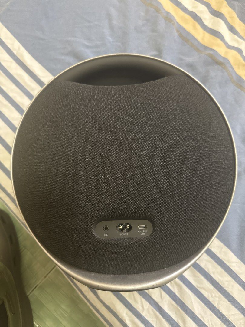 Harman Kardon Onyx Studio 9 Wireless Speaker (Category: Soundbars, Speakers & Amplifiers) located in Manila. Submitted by warm.ronmiles (Listing ID 1467670145, Image 3). Description: - Authentic Harman Kardon speaker in stylish black with a modern silver trim - Iconic round silhouette with a clean, undamaged fabric grille and stable circular base - Versatile connectivity: Bluetooth, AUX port, power input, and a handy USB-C charge-out port - Deliv