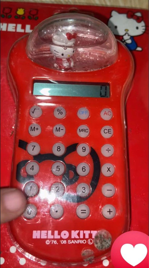 Hello Kitty Red Water Dome Calculator Sanrio 2008 (Category: Stationery & School Supplies) located in Manila. Submitted by janetecson05 (Listing ID 1467613160, Image 1). Description: - Authentic Sanrio Kitty collectible calculator - Features a fun liquid water dome on top with a floating figure - Clear buttons and black character graphic on the face - Fully functional display screen for daily desk use - Dated 1976 and 2008 on the front - Comes wi