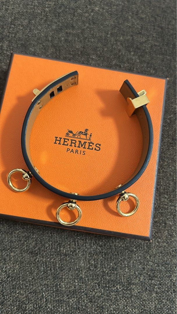 Hermes Blue Leather Bracelet with Gold Hardware (Category: Luxury Accessories) located in Cavite. Submitted by florabells (Listing ID 1466655458, Image 2). Description: - Brande: Hermès - Style: Leather Bracelet with gold tone ring charms - Color: Vibrant blue with gold-tone hardware and ring details - Fit: Wraps twice around the wrist - Condition: Clean leather and hardware, great for daily wear or stacking - Inclusions: Original orange Hermès b
