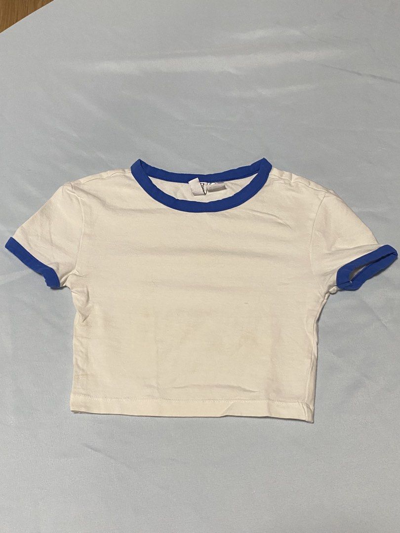 H&M Divided White Blue Ringer Crop Top XXS (Category: Shirts) located in Paranaque City. Submitted by pomeloluvr (Listing ID 1467683264, Image 1). Description: - Brand: H&M Divided - Color: White with royal blue ringer trim - Size: XXS (EUR/US sizing) - Fit: Cropped, short sleeves - Condition: Clean and well-maintained - Style: Casual everyday basic tee - Bundle of 2 for P150 only - Each top P85.