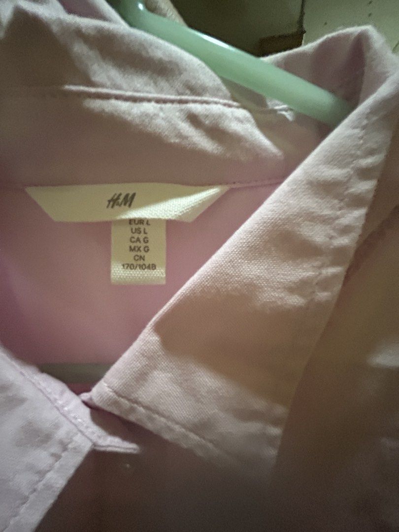 H&M Light Pink Long Sleeve Button-Down Shirt (Category: Longsleeves) located in Makati City. Submitted by sophcrates (Listing ID 1467697001, Image 2). Description: - Brand: H&M - Color: Soft light pink - Size: Large Great condition! Used once lang RFS: decluttering PM for more info last price indicated .