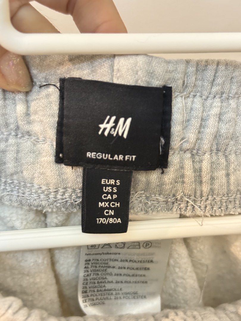 H&M Regular Fit Grey Sweatpants Joggers Size S (Category: Joggers) located in Manila. Submitted by strawberryfriends (Listing ID 1467654222, Image 2). Description: - Brand: H&M - Size: Small (EUR S / US S) - Fit: Regular fit with comfortable elastic waistband and white drawstring - Features: Practical side pockets and stylish ribbed ankle cuffs - Material: Soft cotton, polyester, and viscose blend - Condition: Great for everyday casual wear and l