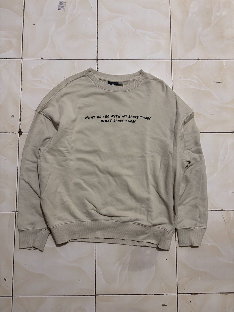H&M x Keith Haring Oversized DJ Sweatshirt Size L (Category: Coats, Jackets and Outerwear) located in Davao. Submitted by chazethrift (Listing ID 1467739314, Image 3). Description: - Brand: H&M - Item: Oversized crewneck sweatshirt - Color: Light beige - Size: Large - Design: Keith Haring DJ graphic on the back with text on the front ('What do i do with my spare time? What spare time?') - Fit: Comfortable slouchy fit with ribbed cuffs and hem - C