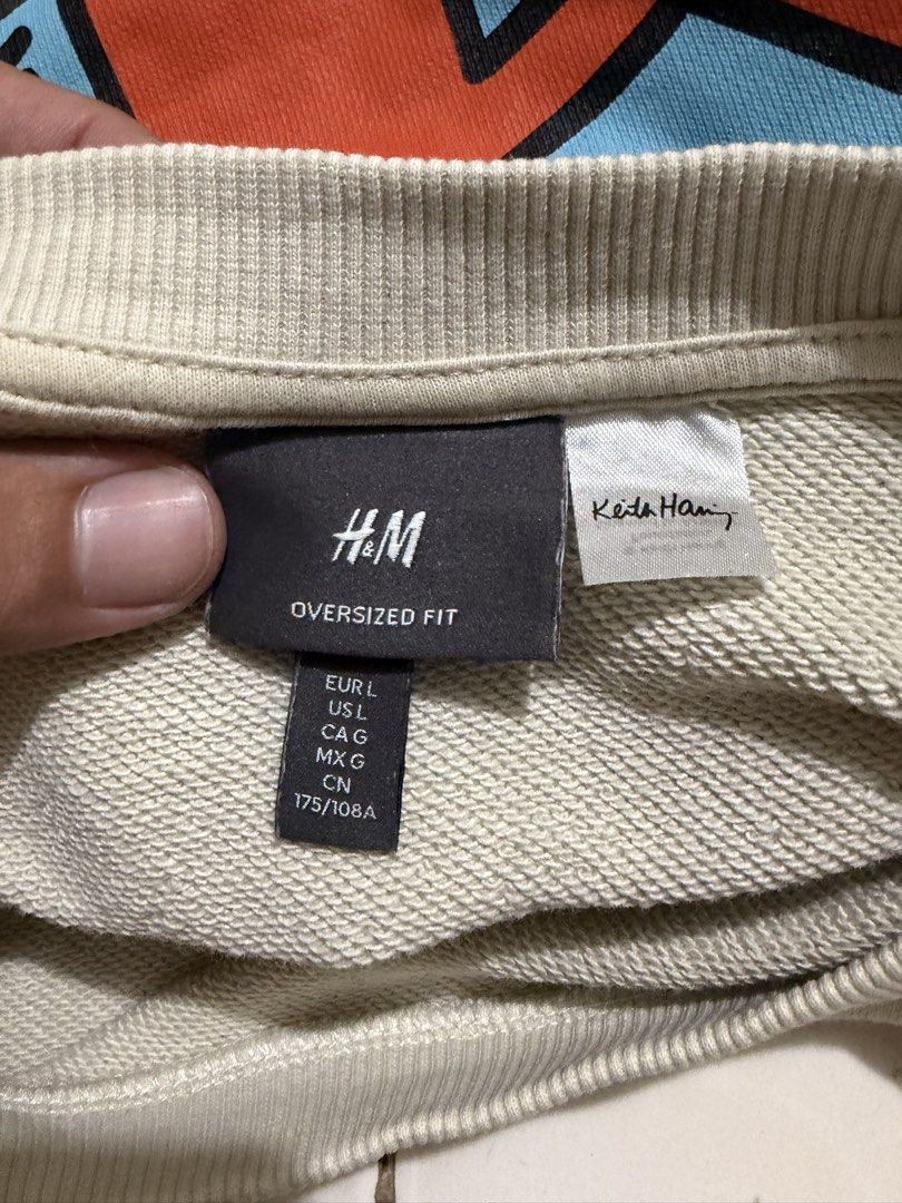 H&M x Keith Haring Oversized DJ Sweatshirt Size L (Category: Coats, Jackets and Outerwear) located in Davao. Submitted by chazethrift (Listing ID 1467739314, Image 2). Description: - Brand: H&M - Item: Oversized crewneck sweatshirt - Color: Light beige - Size: Large - Design: Keith Haring DJ graphic on the back with text on the front ('What do i do with my spare time? What spare time?') - Fit: Comfortable slouchy fit with ribbed cuffs and hem - C