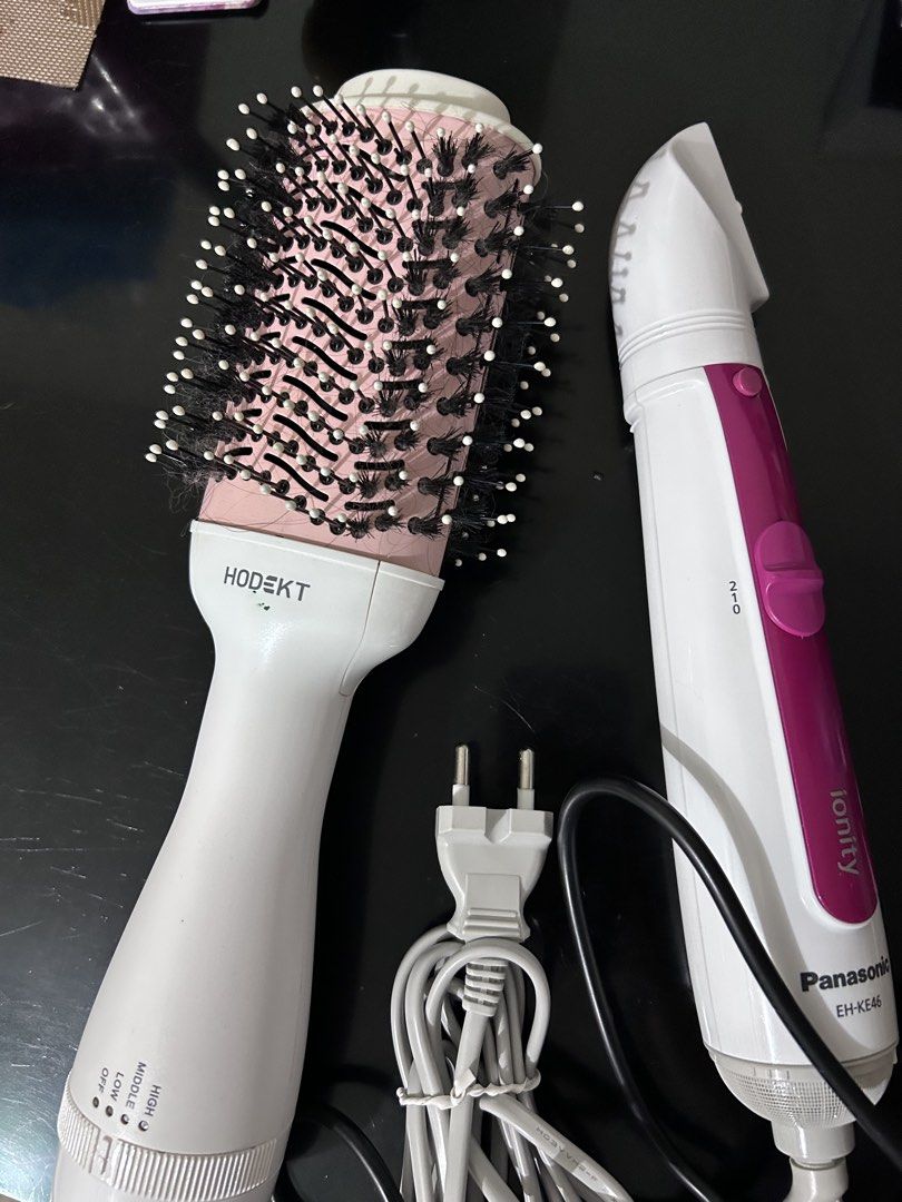 Hodekt and Panasonic Ionity Hair Styling Tools Bundle (Category: Hair) located in Quezon City. Submitted by emmany (Listing ID 1467767822, Image 1). Description: - 2-in-1 Hair Styling Tools Bundle: Hodekt hot air brush and Panasonic Ionity (Model EH-KE46) - Hodekt features a pink barrel, white handle, and convenient base multi-speed settings - Panasonic Ionity comes in a stylish white and magenta colorway - Includes power cords with standard PH p