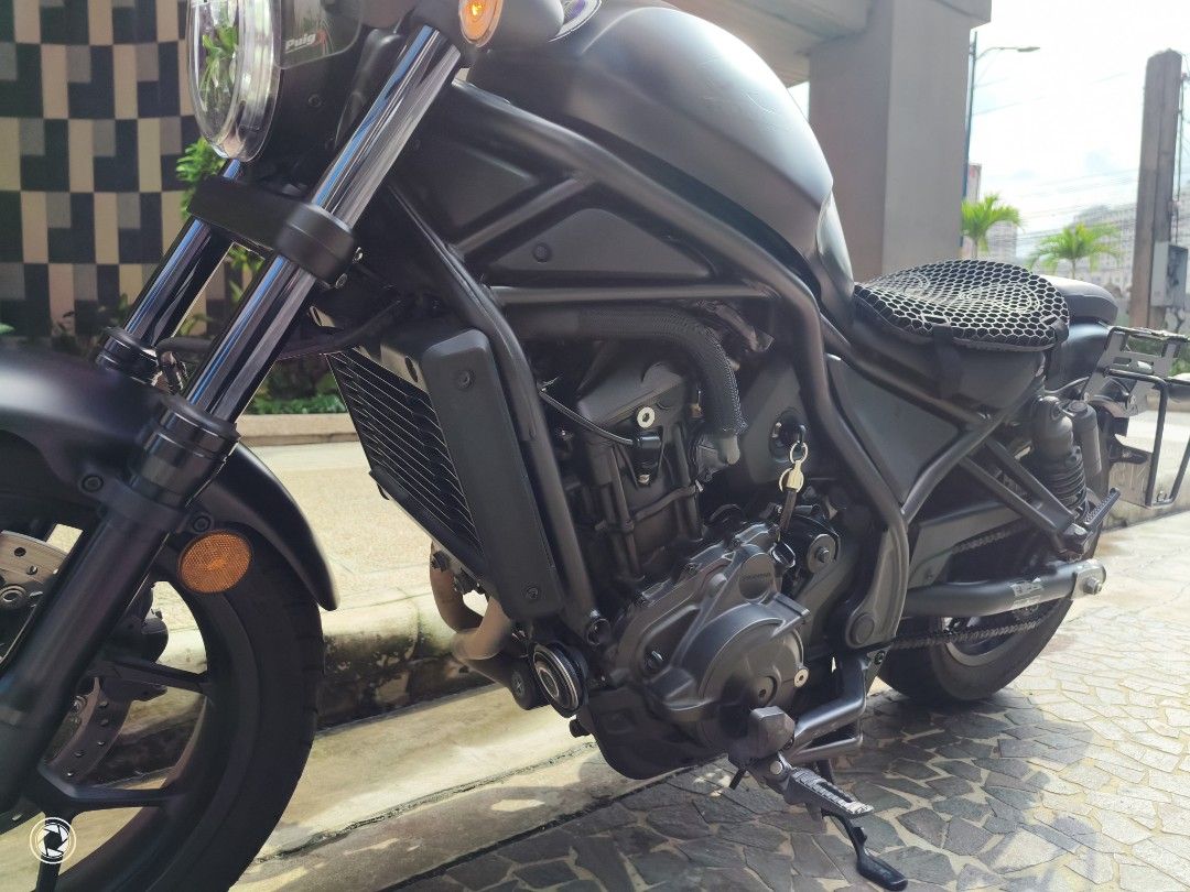 Honda Rebel 1100 DCT (Category: Motorbikes for Sale) located in Mandaluyong City. Submitted by ryancab2026 (Listing ID 1467730978, Image 3). Description: Honda Rebel 1100 cruiser motorcycle. 12xxx km Matte black finish throughout. Puig windshield rear luggage rack mount Clean bodywork, well maintained. No to open deed of sale.
