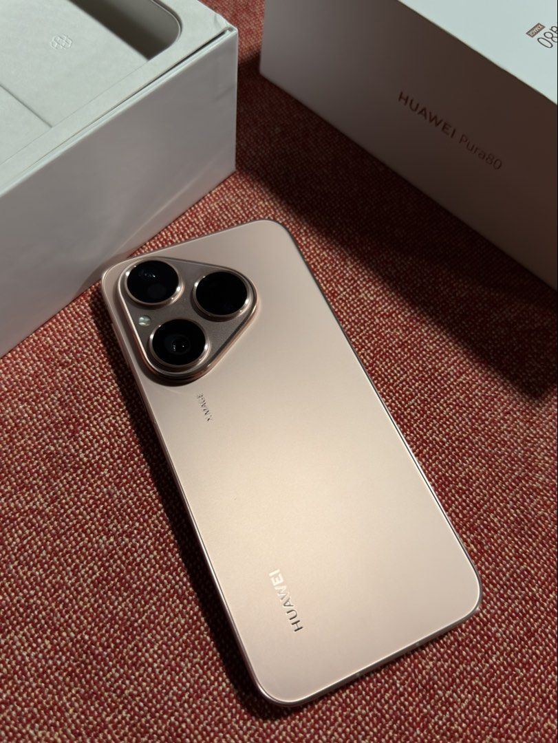Huawei Pura 80 (Category: Huawei) located in Mandaluyong City. Submitted by gee028 (Listing ID 1467719797, Image 1). Description: - Brand/Model: Huawei Pura 80 - Color: Frosted Gold - Design: Premium metallic flat frame with a distinctive triangular triple-camera module (XMAGE technology) - Ports & Build: Clean bottom layout with USB-C port, speaker grille, and SIM tray; slim and modern profile - Perfect for daily use, photography, and stylish te
