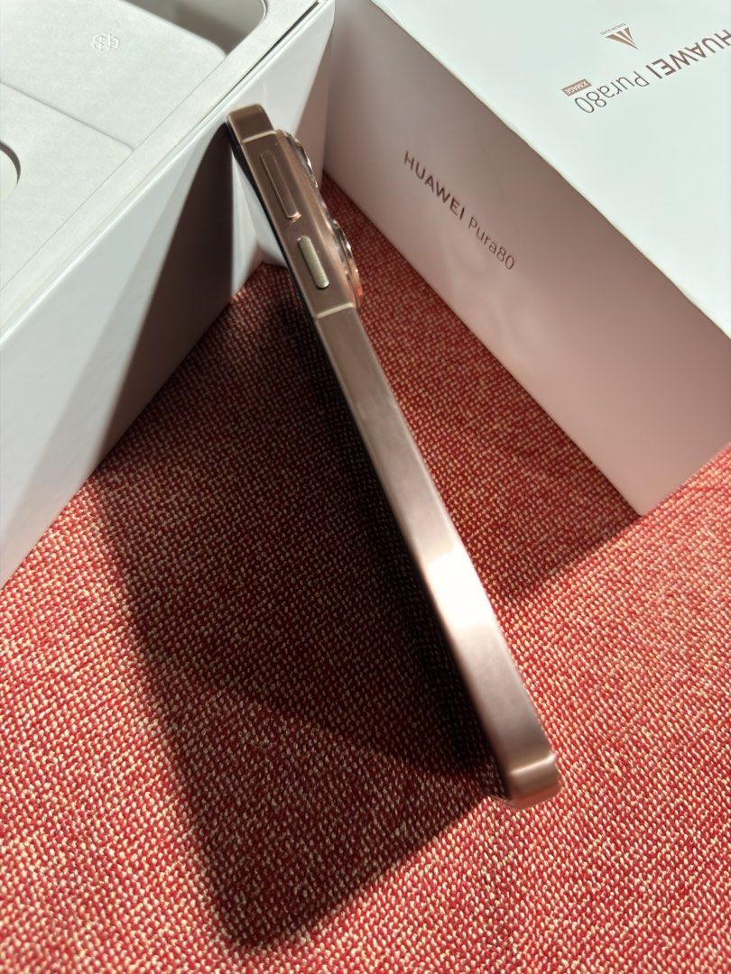 Huawei Pura 80 (Category: Huawei) located in Mandaluyong City. Submitted by gee028 (Listing ID 1467719797, Image 2). Description: - Brand/Model: Huawei Pura 80 - Color: Frosted Gold - Design: Premium metallic flat frame with a distinctive triangular triple-camera module (XMAGE technology) - Ports & Build: Clean bottom layout with USB-C port, speaker grille, and SIM tray; slim and modern profile - Perfect for daily use, photography, and stylish te