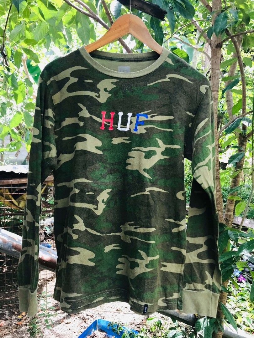 HUF Camo Long Sleeve Shirt (Category: Tshirts & Polo Shirts ) located in Camiling. Submitted by akosiano (Listing ID 1467651910, Image 1). Description: - Authentic HUF long sleeve shirt - All-over green camouflage print - Classic crewneck with ribbed cuffs and collar - Eye-catching HUF logo embroidered in red, white, and blue on the chest - Small branded tag on the lower hemline - Great streetwear piece for everyday wear - Condition: Excellent / 