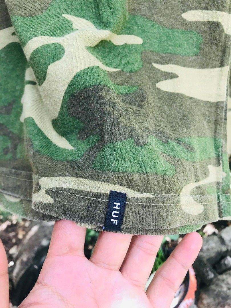 HUF Camo Long Sleeve Shirt (Category: Tshirts & Polo Shirts ) located in Camiling. Submitted by akosiano (Listing ID 1467651910, Image 2). Description: - Authentic HUF long sleeve shirt - All-over green camouflage print - Classic crewneck with ribbed cuffs and collar - Eye-catching HUF logo embroidered in red, white, and blue on the chest - Small branded tag on the lower hemline - Great streetwear piece for everyday wear - Condition: Excellent / 