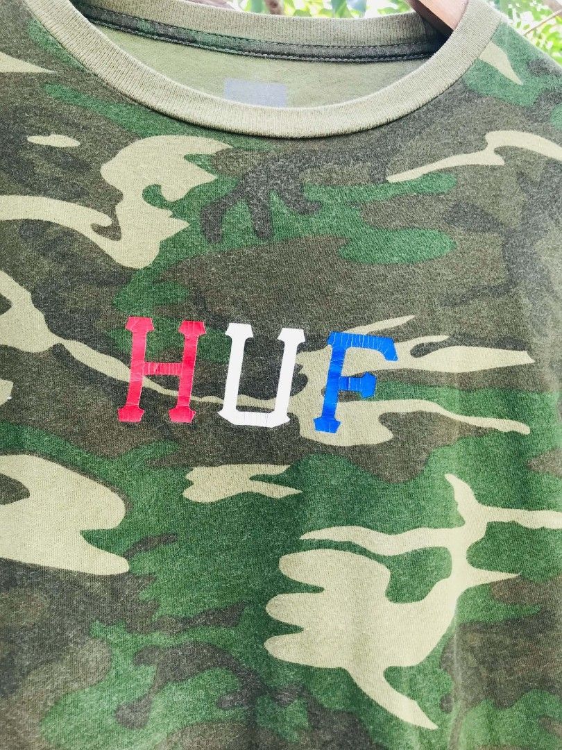 HUF Camo Long Sleeve Shirt (Category: Tshirts & Polo Shirts ) located in Camiling. Submitted by akosiano (Listing ID 1467651910, Image 3). Description: - Authentic HUF long sleeve shirt - All-over green camouflage print - Classic crewneck with ribbed cuffs and collar - Eye-catching HUF logo embroidered in red, white, and blue on the chest - Small branded tag on the lower hemline - Great streetwear piece for everyday wear - Condition: Excellent / 