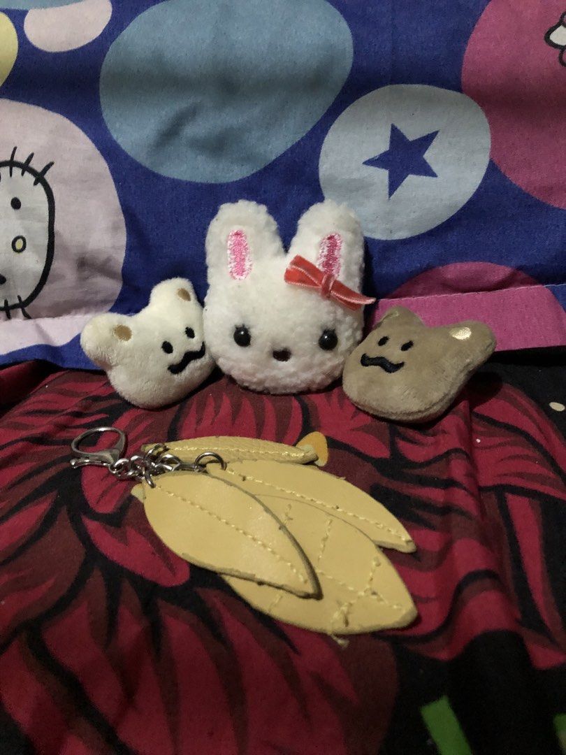 Imported Japan Plush Pins & Leaf Keychain Charm — Set (Category: Charms) located in San Juan, La Union. Submitted by declutteringog7 (Listing ID 1467629560, Image 1). Description: 🐰 Cute Plush Pins & Leaf Charm — Set ₱200 Category: Accessories > Charms & Pins Includes: • 1 Bunny plush pin — soft fabric, with red ribbon bow • 2 Bear/toast face plush pins — cream & brown • 1 Yellow leaf bag charm keychain — faux leather leaves with lobster clasp D