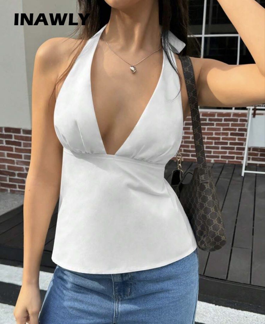 INAWLY White Summer Halter Neck Tie Back Camisole (Category: Sleeveless) located in Caloocan City. Submitted by lysomuch (Listing ID 1467681374, Image 1). Description: - Brand/Item: INAWLY white summer camisole - Deep V-neck with halter neck design - Adjustable tie-back closure Used Once! .