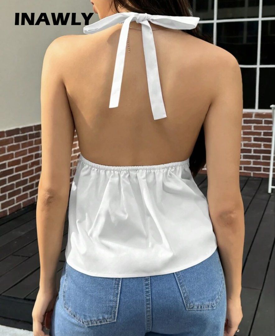 INAWLY White Summer Halter Neck Tie Back Camisole (Category: Sleeveless) located in Caloocan City. Submitted by lysomuch (Listing ID 1467681374, Image 2). Description: - Brand/Item: INAWLY white summer camisole - Deep V-neck with halter neck design - Adjustable tie-back closure Used Once! .