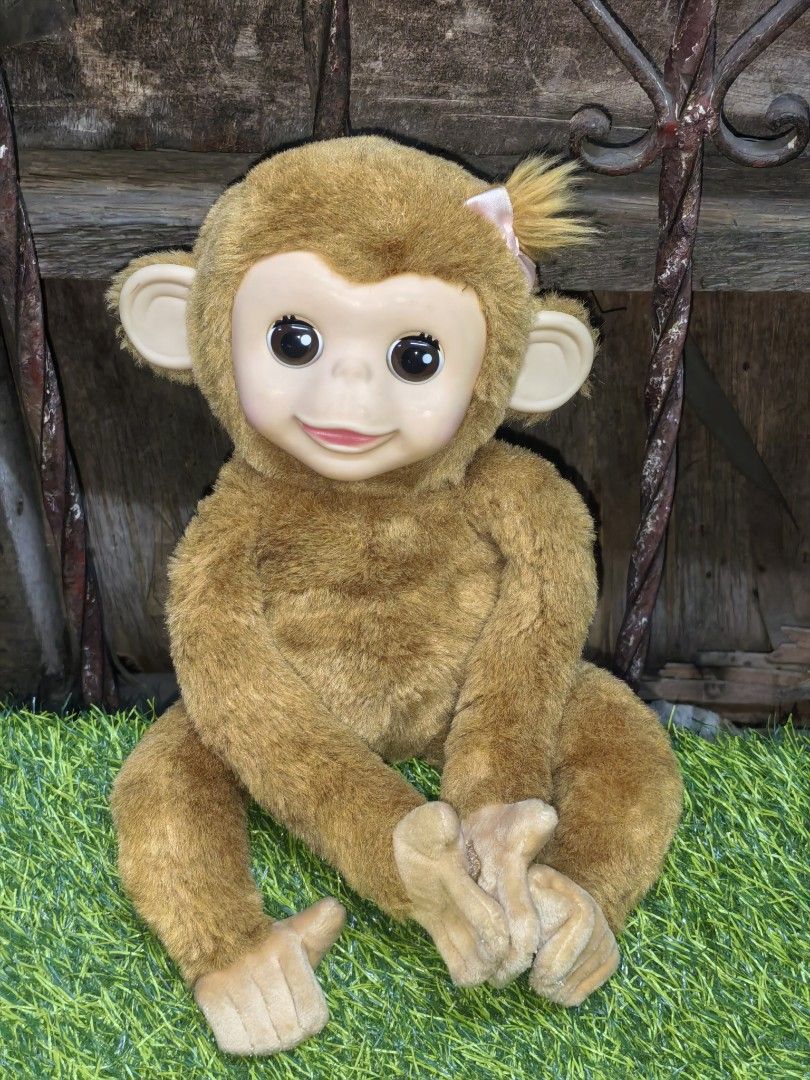 Interactive Monkey Plush Toy with Pink Hair Bow (Category: Plushies & Soft Toys) located in Paranaque City. Submitted by furugiyafinds (Listing ID 1467686528, Image 1). Description: - Adorable plush monkey with soft brown fur and a gentle vinyl face - Features big dark eyes, a sweet smile, and a cute ponytail with a light pink ribbon - Realistic hands and feet with a soft, huggable body - Clean and well-maintained condition - Perfect for cuddling