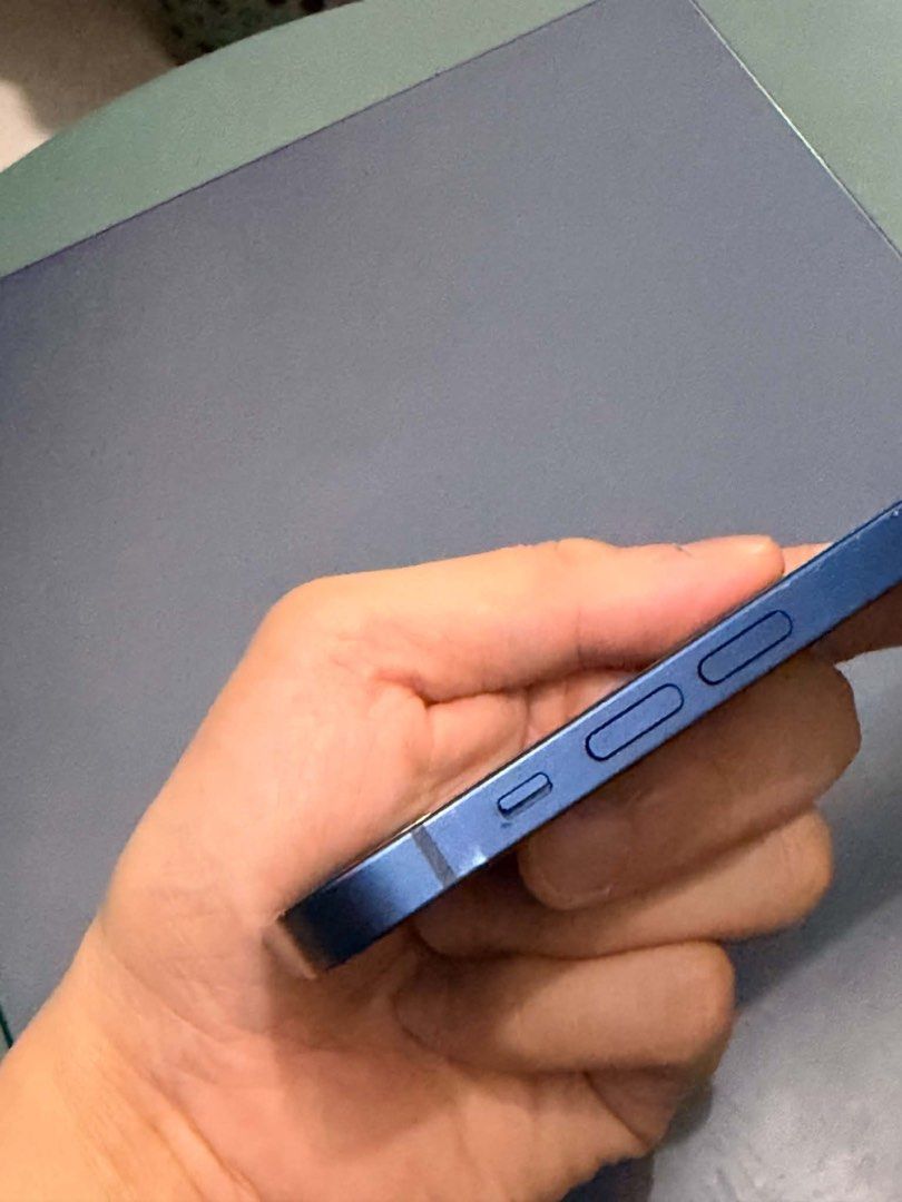 Iphone 12 (newly replaced baterry Genuine) (Category: iPhone 12 Series) located in Quezon City. Submitted by AlbertC221 (Listing ID 1467711455, Image 2). Description: - Model: iPhone 12 - Color: Pacific Blue - Storage: 128GB - Network: Open line - Battery: Newly replaced Genuine Apple battery with 100% health with receipt - Inclusions: Lightning cable - Meetup: SM North EDSA Transport Terminal, Quezon City.