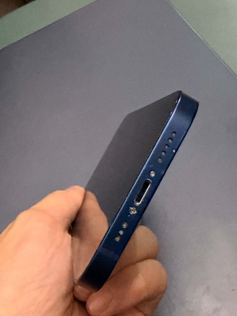 Iphone 12 (newly replaced baterry Genuine) (Category: iPhone 12 Series) located in Quezon City. Submitted by AlbertC221 (Listing ID 1467711455, Image 3). Description: - Model: iPhone 12 - Color: Pacific Blue - Storage: 128GB - Network: Open line - Battery: Newly replaced Genuine Apple battery with 100% health with receipt - Inclusions: Lightning cable - Meetup: SM North EDSA Transport Terminal, Quezon City.