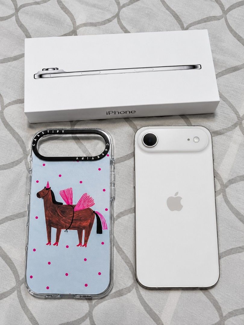 iPhone Air 256gb with Case and Box (Category: Cases & Sleeves) located in Manila. Submitted by jakeyprelovedstuff (Listing ID 1467748088, Image 1). Description: - Includes: Original packaging box - Freebie: Authentic Casetify clear case (quirky pink-winged horse art on blue polka dot background) - Deal type: Full set bundle, ready for quick deal.