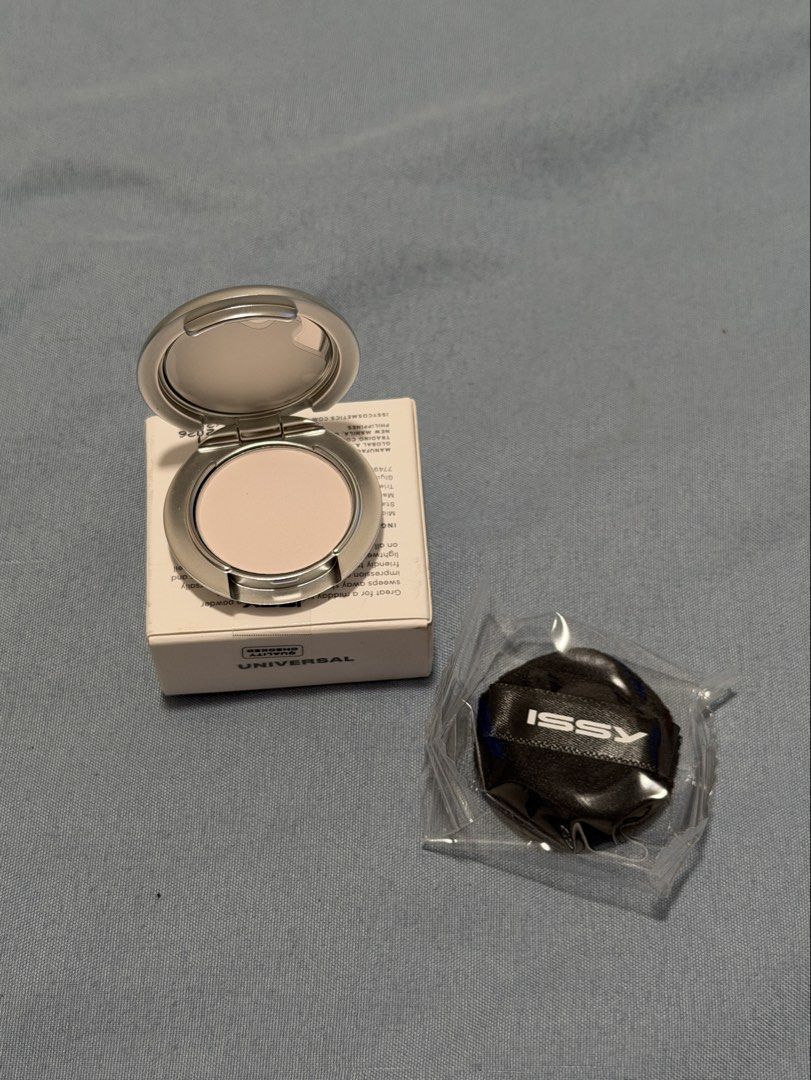Issy Universal Mini Fixing Powder (Category: Makeup) located in Cavite. Submitted by mcxmcxmc (Listing ID 1467616234, Image 2). Description: - Brand: Issy - Product: Universal Pressed Powder in compact case - Condition: Brand new, completely unused, with original cardboard box - Packaging: Sleek silver case with a built-in mirror inside the lid - Inclusions: Unopened black powder puff - Shade: Universal (suits all skin tones) - Benefits: Great fo