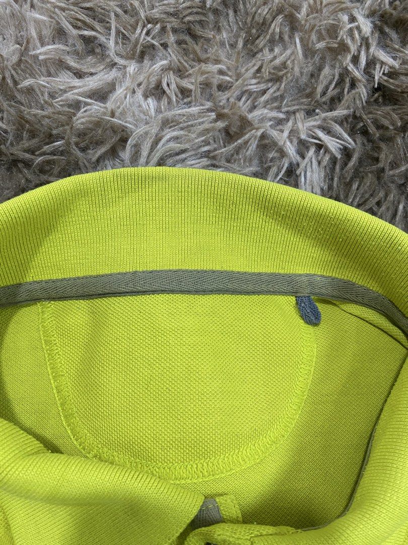 Jack Wolfskin Lime Green Polo Shirt (Category: Tshirts & Polo Shirts ) located in Cagayan de Oro. Submitted by sepamorash53558 (Listing ID 1467642821, Image 3). Description: - Brand: Jack Wolfskin - Color: Bright lime green - Design: Classic button placket with grey buttons and embroidered chest logo - Condition: Clean fabric texture - Measurements: 21 inches chest width x 27 inches length - Origin: Made in Indonesia.