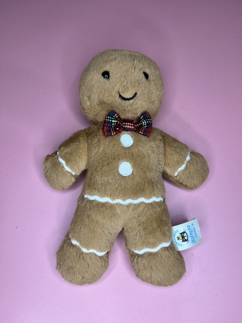 Jellycat Amuseables Gingerbread Man Plush Toy (Category: Plushies & Soft Toys) located in Caloocan City. Submitted by snapshop_ph (Listing ID 1467645026, Image 1). Description: - Authentic Jellycat Amuseables Gingerbread Man plush toy - Super soft brown fur with embroidered face and white icing details - Festive red and green plaid tartan bow tie and two white chest buttons - Original tag still attached - Clean, well-maintained, and from a smoke-