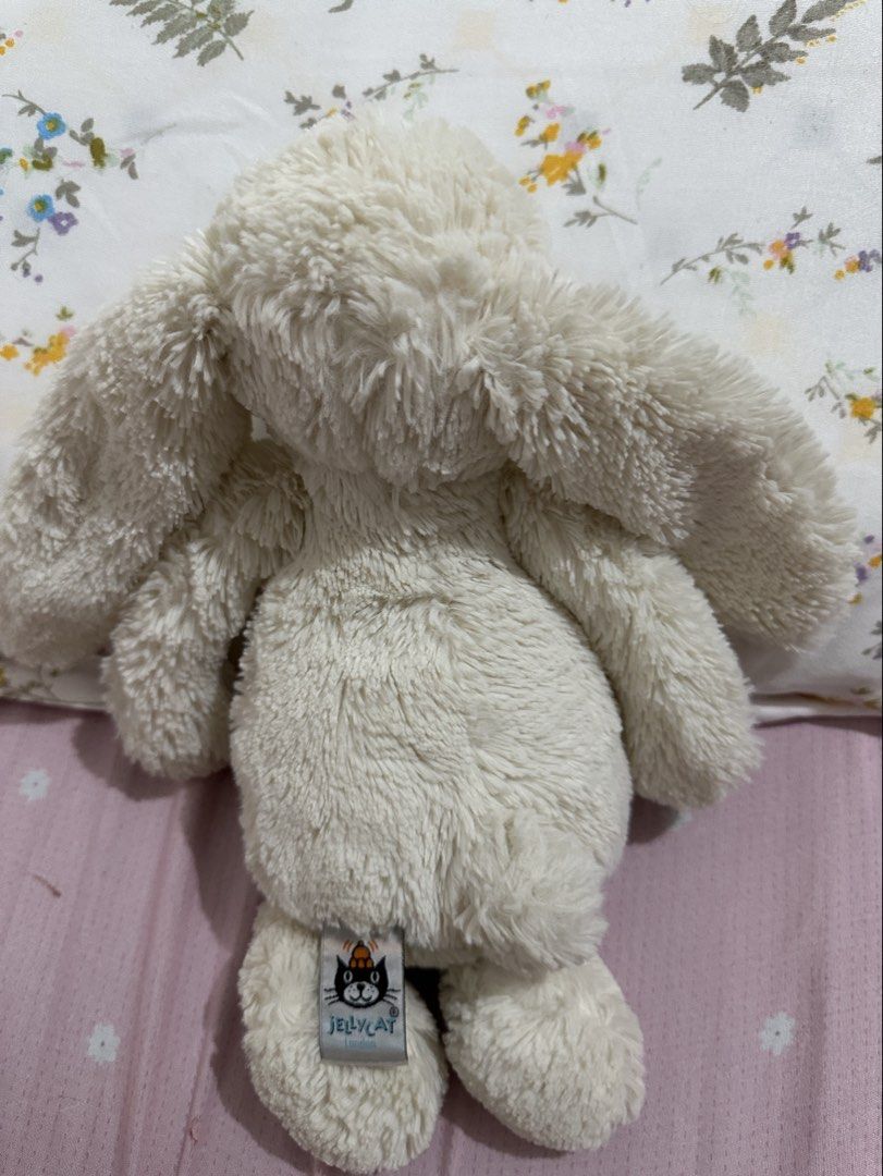 Jellycat Bashful Bunny Cream Stuffed Animal (Category: Plushies & Soft Toys) located in Lipa City. Submitted by chiechums (Listing ID 1467640582, Image 2). Description: - 100% Authentic Jellycat Bashful Bunny plush toy - Soft cream-colored fur with floppy ears and a sweet pink stitched nose - Official Jellycat London tag attached on the back - Fluffy texture throughout the body and limbs, sits upright easily - Clean, well-maintained, and ready fo