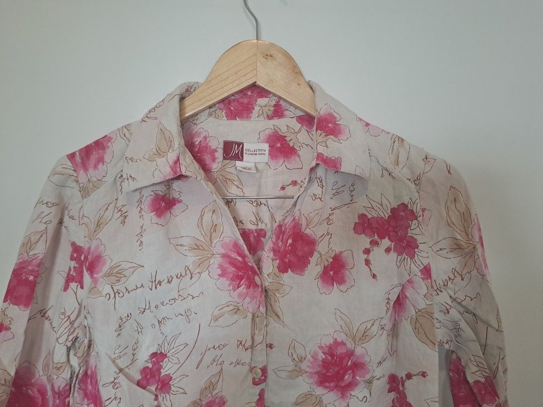 JM COLLECTION 100% LINEN (Category: Longsleeves) located in Manila. Submitted by joanbalde39643 (Listing ID 1467660257, Image 2). Description: This is a women's 100% linen button-down blouse from the brand JM Collection. It features an all-over bright pink watercolor floral pattern layered on top of an ecru/cream background with faint cursive script handwriting graphics.