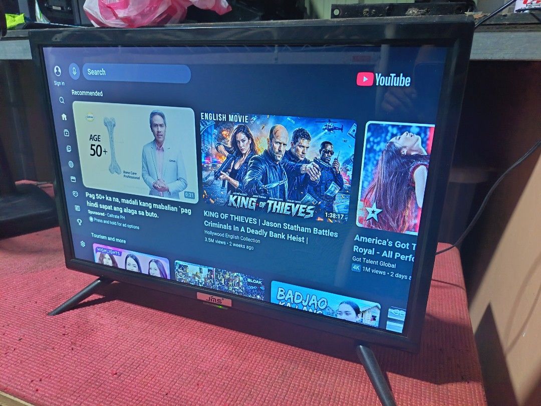 JMS Smart TV Android Television with YouTube and Netflix (Category: TV) located in Caloocan City. Submitted by princessyumie (Listing ID 1467627585, Image 3). Description: - Brand: JMS Smart TV - Condition: Good working condition - Display: Vibrant display with clear picture quality - Built-in Apps: YouTube and Netflix ready for streaming - Inclusions: remote control and stable stand legs - Ideal Use: Perfect setup for bedroom or living room Pick