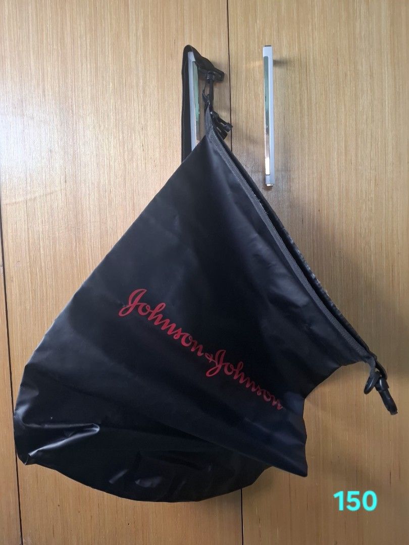 Johnson & Johnson Branded Black Waterproof Dry Bag (Category: Other Sports Equipment and Supplies) located in Pasay City. Submitted by emilia1102 (Listing ID 1467788458, Image 2). Description: - Color: Sleek black with red Johnson & Johnson logo - Material: Waterproof design with secure roll-top closure - Included: Adjustable black strap with durable clips - Best for: Outdoor activities, water sports, and travel storage.