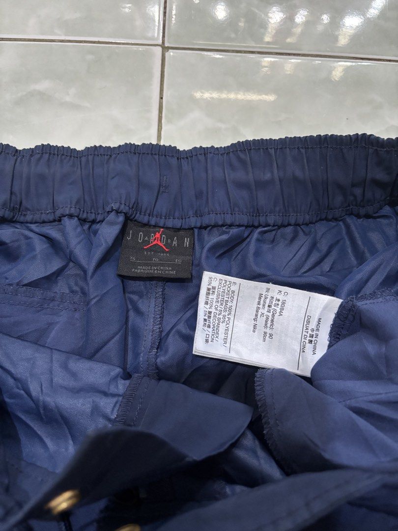 Jordan Navy Blue Shorts Size XL (Category: Shorts) located in Daraga. Submitted by hannieldustin (Listing ID 1467635094, Image 2). Description: - Brand: Jordan - Color: Navy Blue - Size: XL 34 waist 19 length - Details: Embroidered gold Jumpman logo and vintage Jordan lettering - Closure: Drawstring waistband with snap button and zipper fly - Material: 100% polyester - Origin: Made in China.