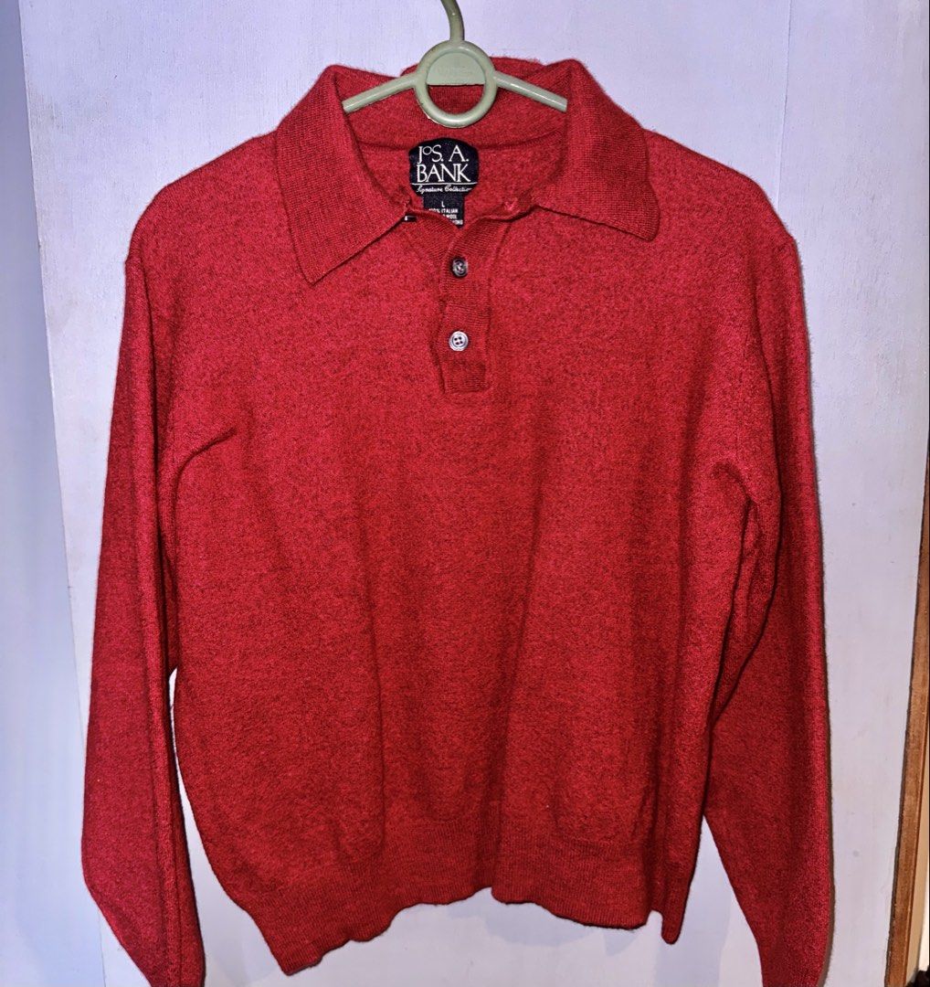 Jos. A. Bank Red Merino Wool Collared Sweater (Category: Coats, Jackets and Outerwear) located in Cebu City. Submitted by ixiaces (Listing ID 1467697913, Image 1). Description: Red collared sweater from Jos. A. Bank Signature Collection. Long sleeves, 2-button front placket, knit texture. 100% Italian merino wool material, made in Hong Kong. Size large. Deep red colorway with subtle heathered look. Warm knit construction..