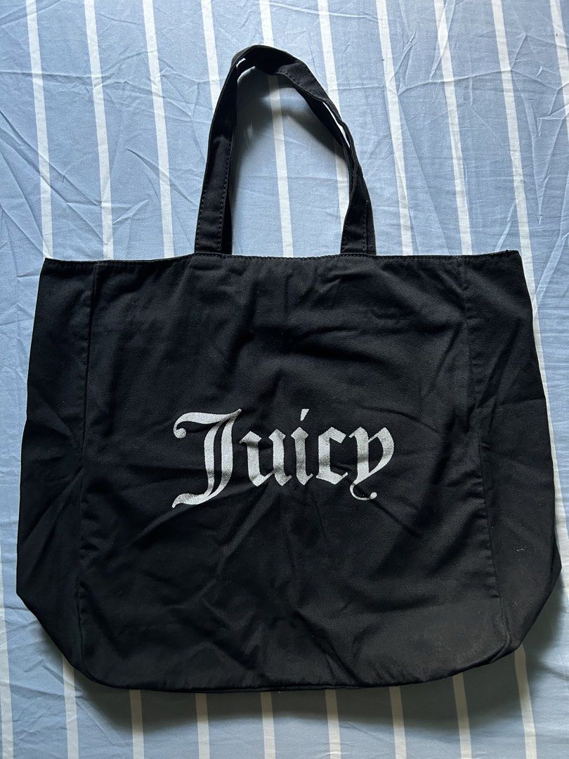Juicy Couture Black Canvas Tote Bag (Category: Tote Bags) located in Bambang. Submitted by mythriftstyle (Listing ID 1467705170, Image 1). Description: - Brand: Juicy Couture - Material: Durable black canvas with big silver front lettering - Closure: Convenient magnetic snap top - Interior: Cute polka dot trim lining along the seams - Capacity: Roomy, fits daily essentials, schools, books, or a laptop - Condition: Clean inside and out, ready for 