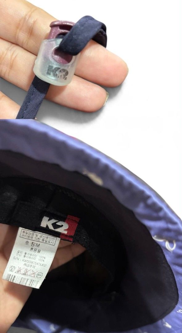 K2 GORE-TEX Bucket Hat Size M (Category: Caps & Hats) located in Iloilo. Submitted by rapha.houseofactivewear.23 (Listing ID 1467641565, Image 3). Description: - Brand: K2 - Material: GORE-TEX (Waterproof tech outdoor gear) - Size: M - Color/Design: Navy blue, reversible with white floral graphic on one side and pink on the reverse - Features: Adjustable chin strap with toggle for a secure fit - Condition: Excellent pre-owned/ready to wear.