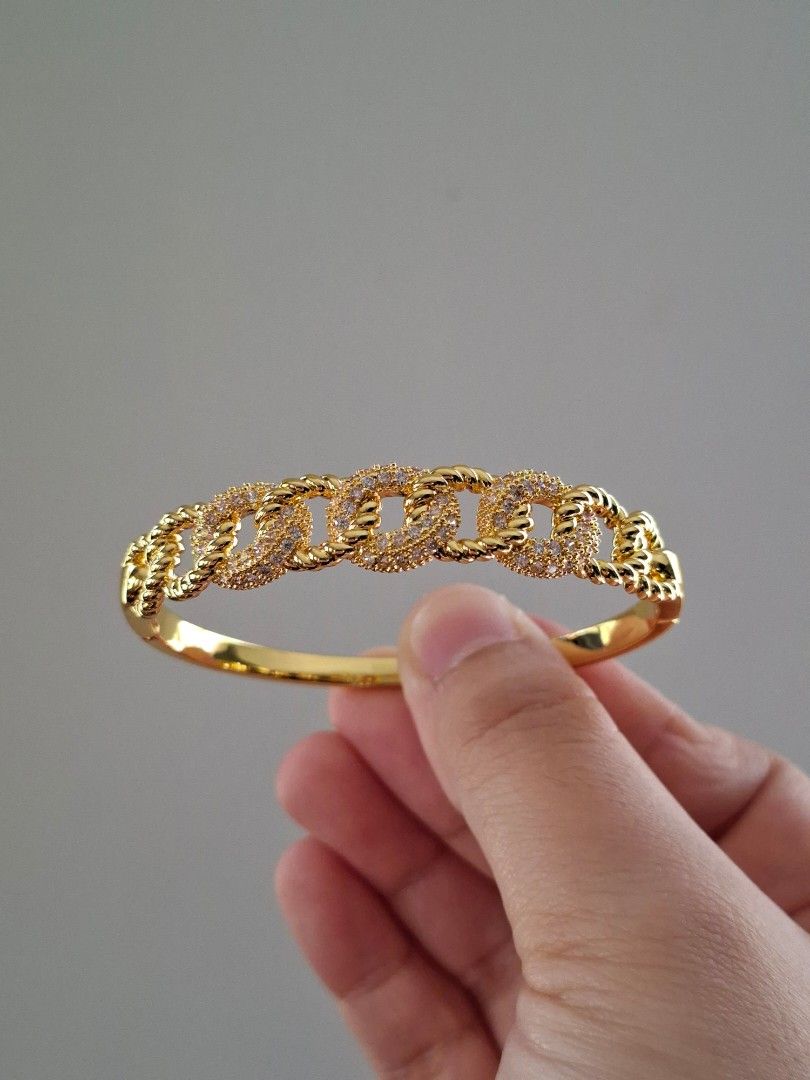 Kadena Chain Pattern Gold Stainless Steel Bangle Bracelet (Category: Bracelets) located in Dasmarinas. Submitted by danabrie22 (Listing ID 1467713979, Image 1). Description: very well-made, excellent crafstmanship 10/10 condition brand new stainless steel & colored cubic zirconia stones made in Hongkong.