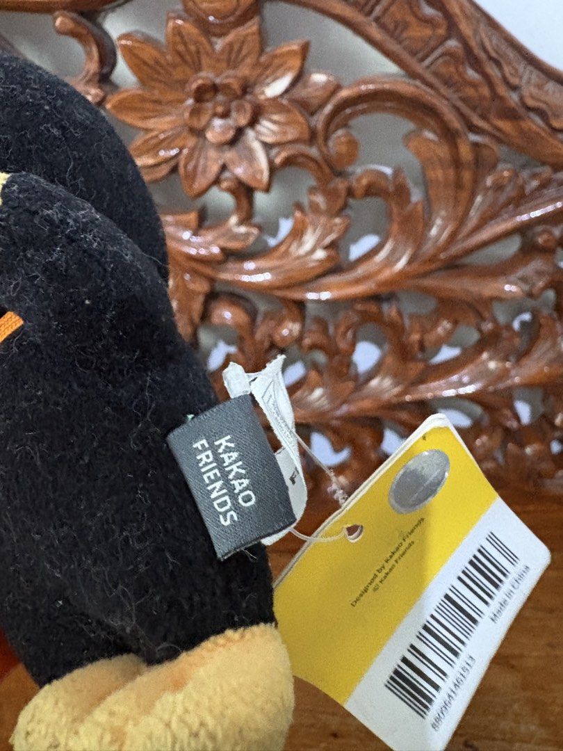 Kakao Friends Ryan Diver Plush Keychain (Category: Plushies & Soft Toys) located in Quezon City. Submitted by rxyel (Listing ID 1467658211, Image 3). Description: - Character: Kakao Friends Ryan - Design: Scuba diver in black wetsuit, gray hood, and orange oxygen tank - Condition: Brand new with original paper hang tag and fabric brand label - Attachment: Sturdy metal keyring included - Color: Yellow and black theme - 100% Authentic and official 