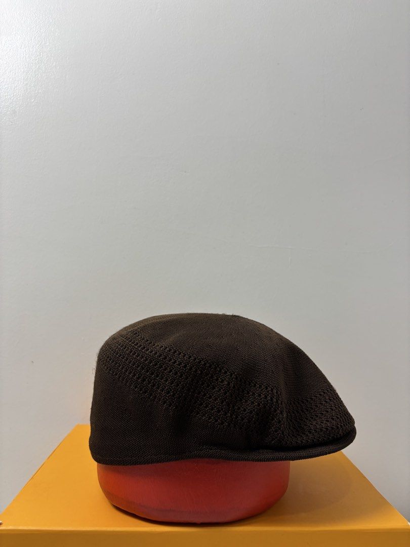 Kangol Tropic Ventair Cap Brown Medium (Category: Caps & Hats) located in Marikina City. Submitted by zaxcheus_castillo1708 (Listing ID 1467653134, Image 2). Description: - Brand: Kangol - Style: Tropic Ventair flat crown cap - Color: Brown - Size: Medium - Details: Iconic embroidered kangaroo logo on front, interior branding tag intact, breathable mesh pattern - Condition: Clean and ready to wear.