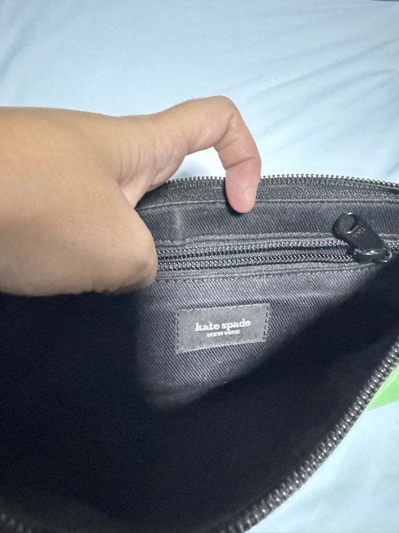 Kate Spade Green Nylon Pochette (Category: Luxury Bags & Wallets) located in Quezon City. Submitted by thriftream (Listing ID 1467711024, Image 3). Description: - Brand: Kate Spade - Style: Single-strap shoulder bag / Everyday carry - Material: Durable nylon in sage green - Closure: Top zip closure - Interior: Black fabric lining with a convenient zippered pocket - Condition: Minor wear near the zipper area, otherwise in great usable condition.