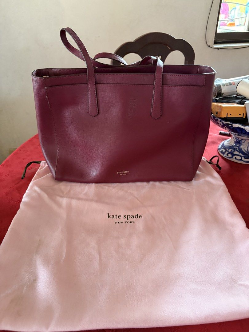 Kate Spade Molly Large Work Tote Bag (Category: Tote Bags) located in Paranaque City. Submitted by erisr (Listing ID 1467631790, Image 3). Description: - Brand/Model: Kate Spade Molly Large Work Tote Bag - Color: Burgundy Red - Material: Premium structured pebbled leather - Features: Spacious interior, secure compartments for laptops and daily essentials, signature Kate Spade hardware and lining - Inclusions: Comes with original Kate Spade dust b
