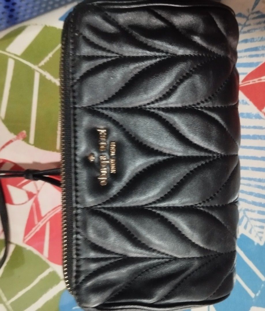 Kate spade quilted small bag (Category: Cross-body Bags) located in Manila. Submitted by lene48 (Listing ID 1467627576, Image 1). Description: - Brand: Kate Spade New York - Color: Classic Black - Material: Quilted leather with soft texture - Hardware: Gold-tone logo and chain strap accents - Design: Chevron quilted pattern with secure zip closure - Condition: Well-maintained, pre-loved in great shape - Size: Compact small bag, ideal for daily es