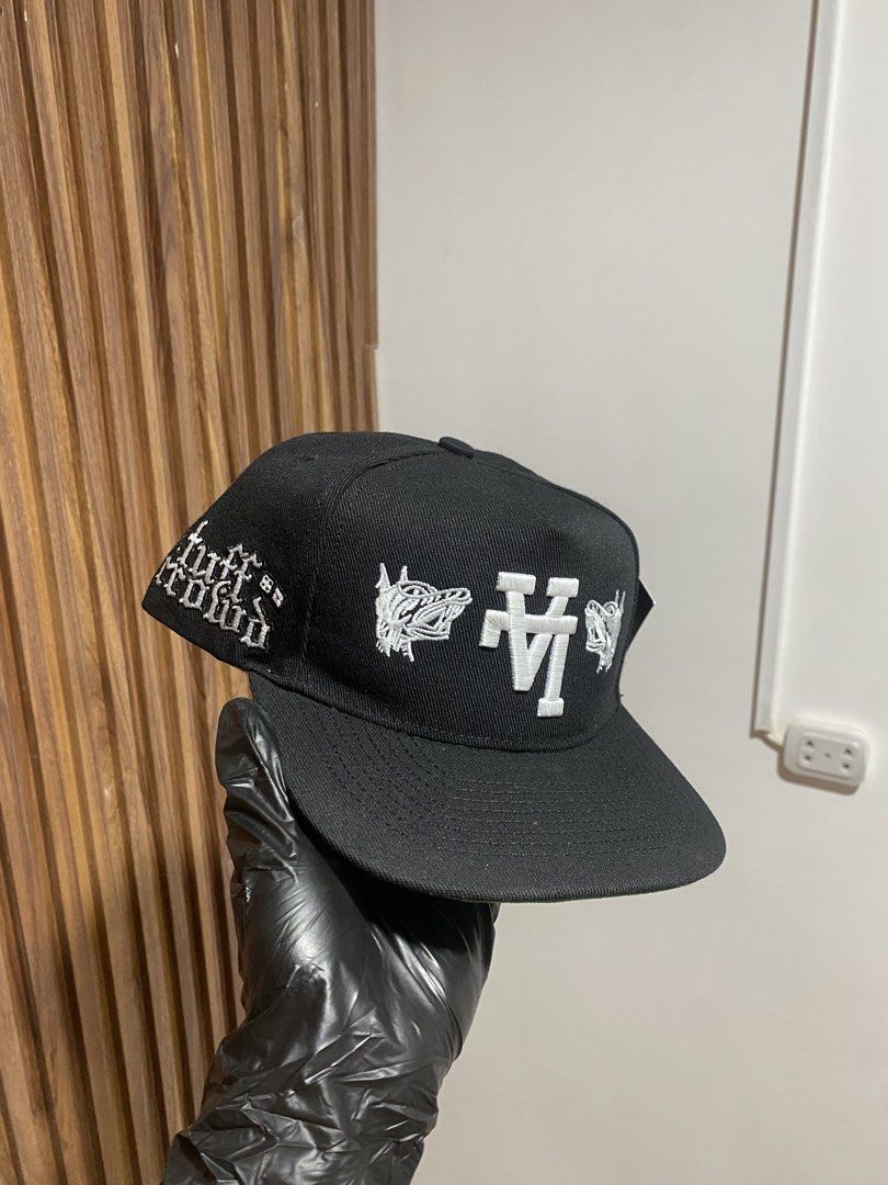 Kill The Hype Los Angeles Black Snapback Hat KTH (Category: Caps & Hats) located in Caloocan City. Submitted by heatedcaps4425 (Listing ID 1467802120, Image 2). Description: - Brand: Kill The Hype LA (KTH) - Style: Black snapback hat - Condition: Brand new with tags (never worn) - Design: White embroidered LA logo with dog graphics on the front - Details: Green underbrim and branded interior taping - Closure: Adjustable snapback with brand text.