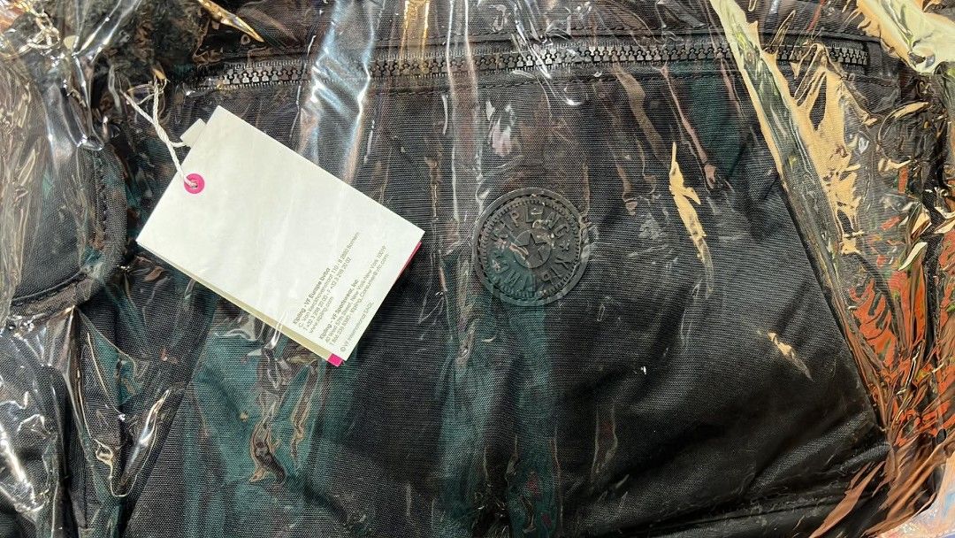 Kipling Black Tote Bag with Monkey Keychain (Category: Tote Bags) located in Pasay City. Submitted by mavie527 (Listing ID 1467618240, Image 2). Description: - Brand: Kipling (Brand new with tags attached) - Color: Classic Black - Features: Secure zip closure, front zippered pocket, and side interior zip pocket - Inclusions: Signature Kipling furry monkey keychain charm - Material: Durable, lightweight, and easy-to-wipe synthetic fabric - Versati
