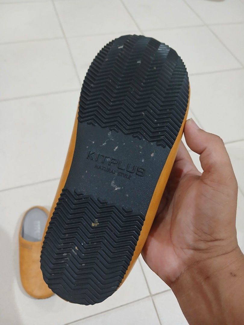 Kitplus Yellow Slip-On Mules Clogs Size M (Category: Slippers and slides) located in Daraga. Submitted by thethriftcity2024 (Listing ID 1467647048, Image 3). Description: - Brand: Kitplus - Style: Easy everyday slip-on mules - Size: M - Upper: Smooth synthetic material with a subtle side branding tag - Insole: Grey cushioned for all-day comfort - Outsole: Black rubber with a textured chevron tread for better grip - Color: Vibrant yellow Size 37 N