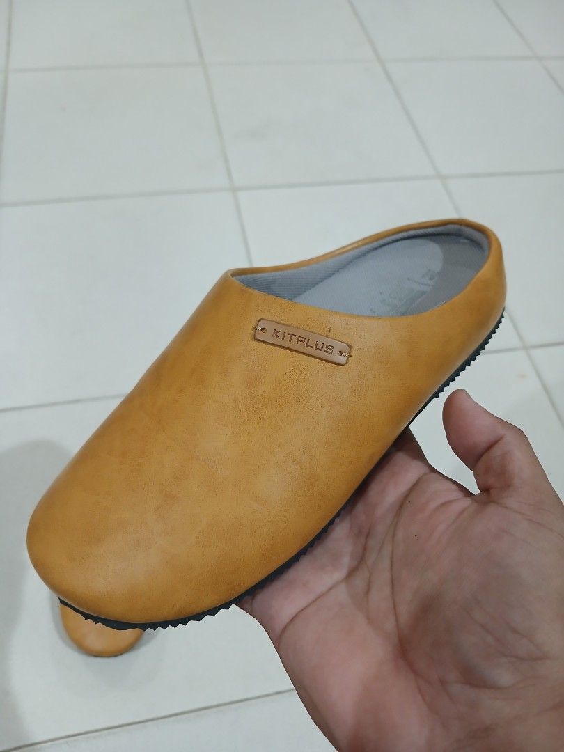 Kitplus Yellow Slip-On Mules Clogs Size M (Category: Slippers and slides) located in Daraga. Submitted by thethriftcity2024 (Listing ID 1467647048, Image 2). Description: - Brand: Kitplus - Style: Easy everyday slip-on mules - Size: M - Upper: Smooth synthetic material with a subtle side branding tag - Insole: Grey cushioned for all-day comfort - Outsole: Black rubber with a textured chevron tread for better grip - Color: Vibrant yellow Size 37 N
