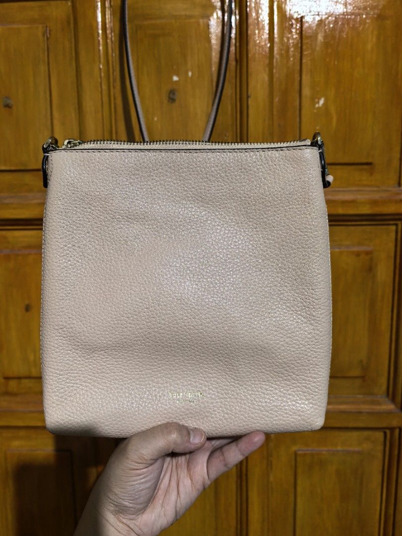 KS sling bag (Category: Cross-body Bags) located in Manila. Submitted by khulet2008 (Listing ID 1467772632, Image 2). Description: Kate ♠️ sling bag in pale pink color Like new condition . Can fit med wallet, iPhone promax Adjustable strap.