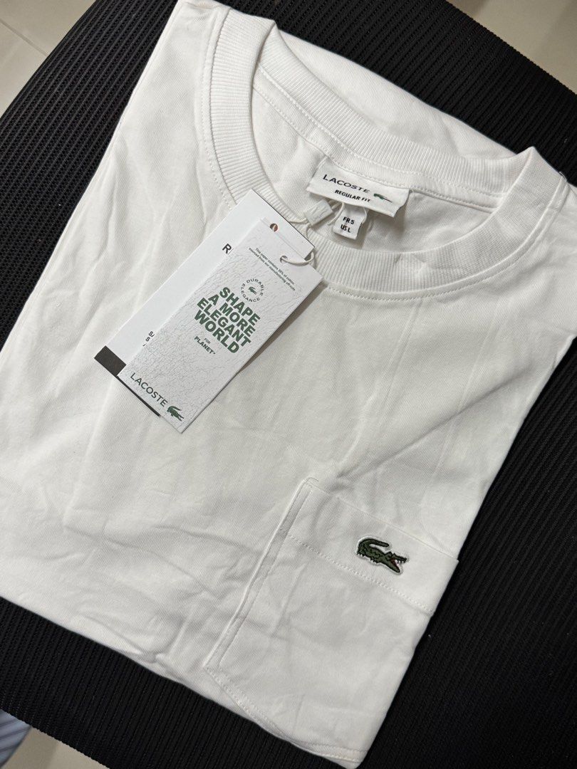 L4cost4 pocket mens shirt (Category: Tshirts & Polo Shirts ) located in Binan City. Submitted by chelsea05855 (Listing ID 1467666592, Image 1). Description: -Lacoste crew neck t-shirts with chest pocket and embroidered green crocodile logo. - Available in Size S,M,L,XL,XXL - original tags attached. (Mall pull out items) -Pick white or black color. -Clean styling, comfortable cotton material. -Great wardrobe staple for daily casual outfits. -Model