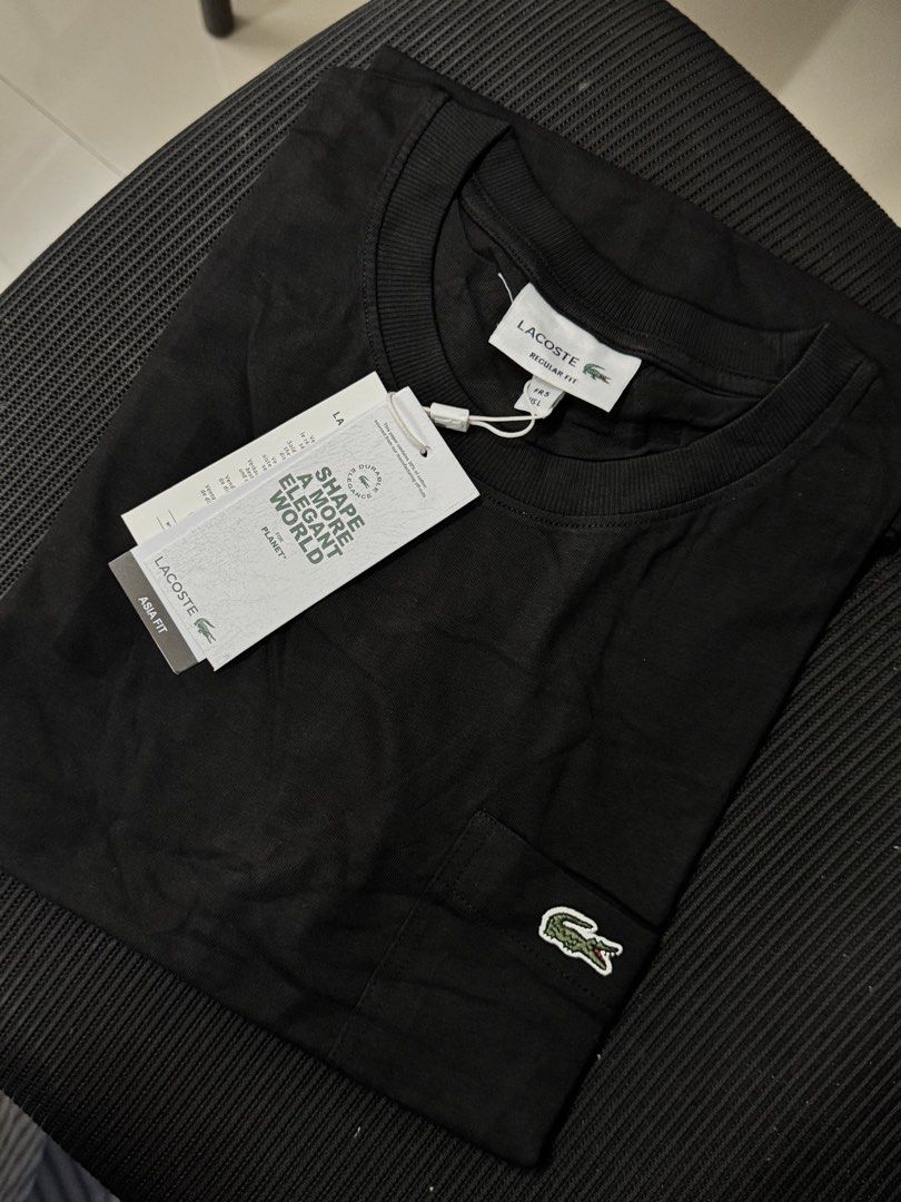 L4cost4 pocket mens shirt (Category: Tshirts & Polo Shirts ) located in Binan City. Submitted by chelsea05855 (Listing ID 1467666592, Image 2). Description: -Lacoste crew neck t-shirts with chest pocket and embroidered green crocodile logo. - Available in Size S,M,L,XL,XXL - original tags attached. (Mall pull out items) -Pick white or black color. -Clean styling, comfortable cotton material. -Great wardrobe staple for daily casual outfits. -Model