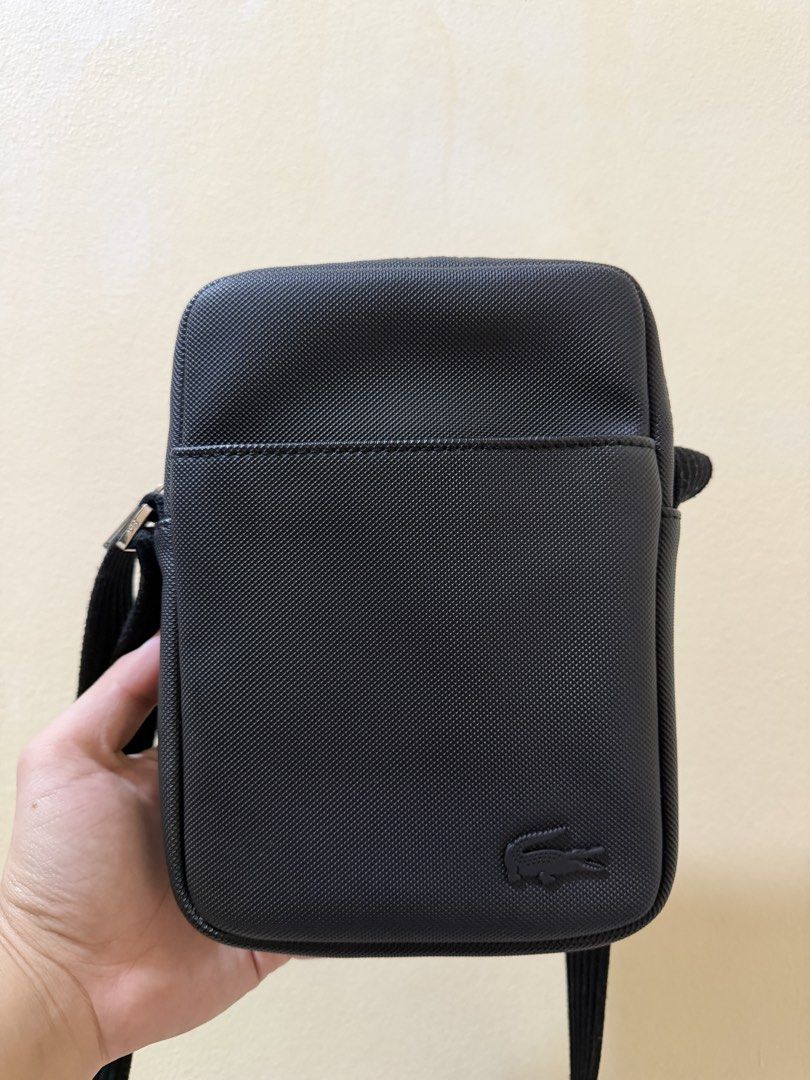 Lacoste Sling Bag (Category: Sling Bags) located in Makati City. Submitted by rfstn (Listing ID 1467801409, Image 1). Description: - Original - Used thrice in mall - No issue.