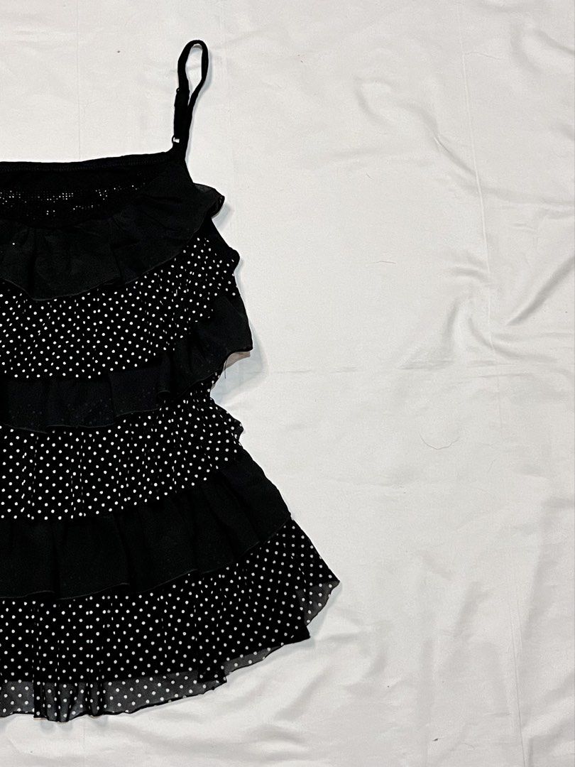 Layered polka dots top (adjustable straps) (Category: Sleeveless) located in Santa Rosa. Submitted by spanishlattelxver (Listing ID 1467742935, Image 3). Description: ⋆ 𝒷𝓇𝒶𝓃𝒹 : — ⋆ 𝓈𝒾𝓏𝑒 : s-m ⋆ 𝒻𝓁𝒶𝓌𝓈 : incomplete rhinestones but not super halata 𓏲ּ𝄢 𝒹𝑒𝓉𝒶𝒾𝓁𝓈 : gorg layered deets! black n white polka 🥹 ⋆˚꩜｡ 𝒎𝒊𝒏𝒆 : ₱249.