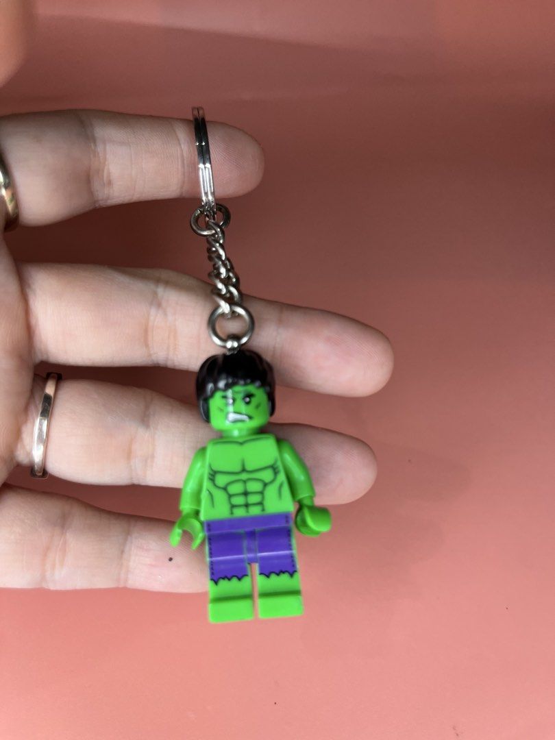 LEGO Hulk Minifigure Keychain Marvel Avengers (Category: Character Goods) located in Caloocan City. Submitted by snapshop_ph (Listing ID 1467644500, Image 2). Description: - Authentic LEGO Hulk minifigure keychain - Features iconic green skin, purple pants, and angry facial expression - Attached to a sturdy metal split ring via a short chain - Standard LEGO stud holes visible on the back of the legs - Clean metal hardware with minimal wear - Perf
